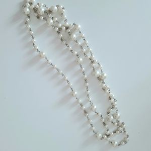 White and silver color necklace